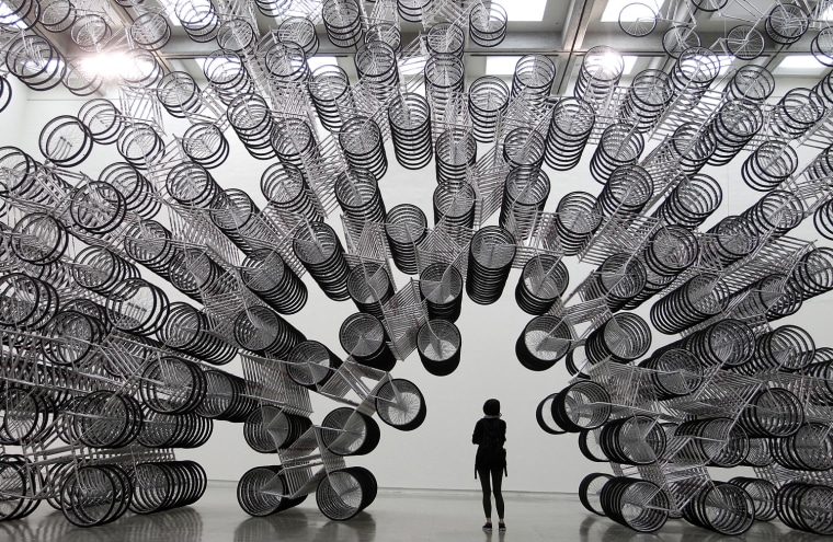 Image: A woman looks at an art installation by dissident Chinese artist Ai Weiwei during a media preview in Taipei